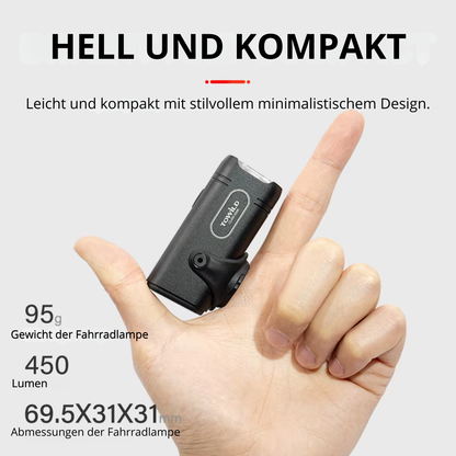 Veltrix Mini Fahrradlampe hell und kompakt in der Hand gehalten